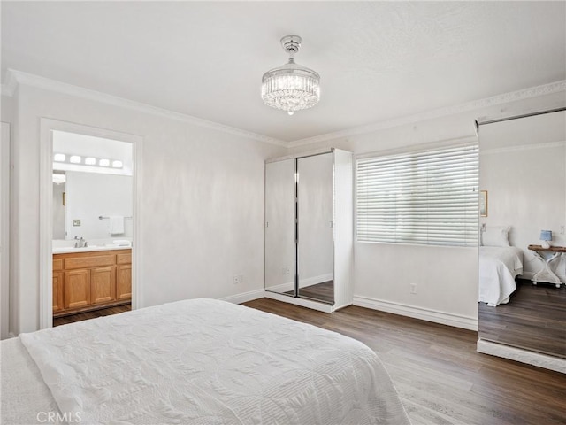 22163 Broken Lance Rd, Apple Valley, CA 92307 - bedroom featuring crown molding, wood finished floors, a chandelier, and connected bathroom