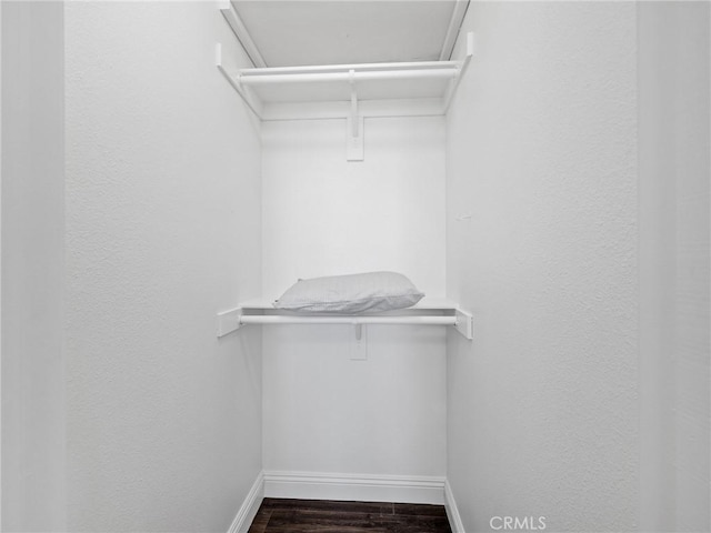 22163 Broken Lance Rd, Apple Valley, CA 92307 - walk in closet featuring dark wood finished floors
