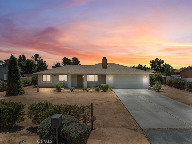 22163 Broken Lance Rd, Apple Valley, CA 92307 - ranch-style home with concrete driveway, a garage, and a chimney