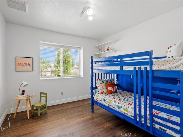 22163 Broken Lance Rd, Apple Valley, CA 92307 - bedroom with wood finished floors and a textured ceiling