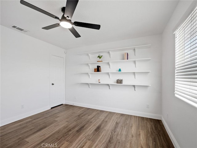 22163 Broken Lance Rd, Apple Valley, CA 92307 - unfurnished room with wood finished floors and a ceiling fan
