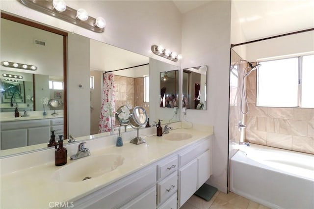 4242 Trenton Ave, Palmdale, CA 93552 - full bathroom featuring double vanity, tile patterned floors, and shower / tub combo