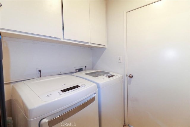 4242 Trenton Ave, Palmdale, CA 93552 - washroom with cabinet space and washing machine and clothes dryer
