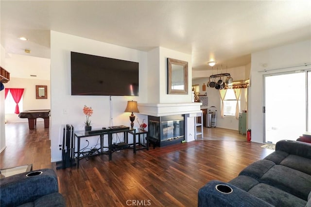 4242 Trenton Ave, Palmdale, CA 93552 - living room with wood finished floors, billiards table, and a multi sided fireplace