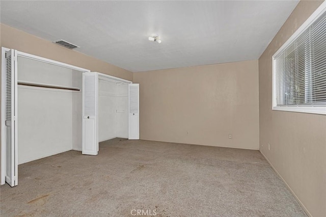 45660 Shain Ave, Dos Palos, CA 93620 - unfurnished bedroom featuring carpet floors and multiple closets