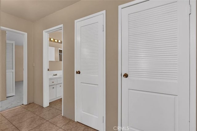45660 Shain Ave, Dos Palos, CA 93620 - hallway with light tile patterned floors and a sink