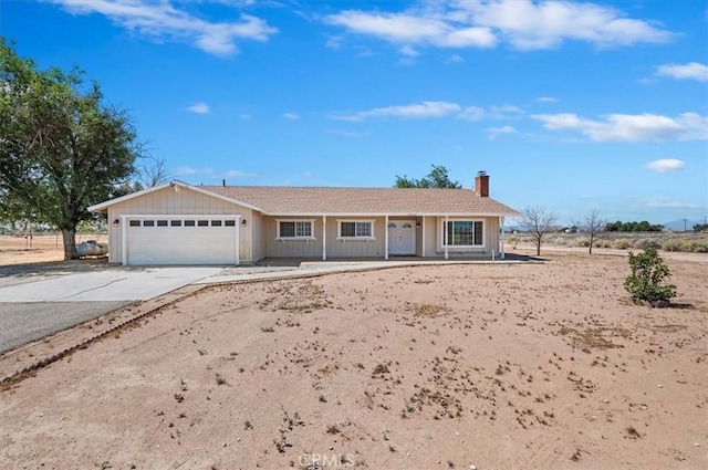23405 Ramona Ave, Apple Valley, CA 92307 - single story home featuring an attached garage, driveway, and a chimney