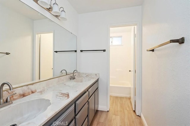 23405 Ramona Ave, Apple Valley, CA 92307 - full bath with wood finished floors and double vanity