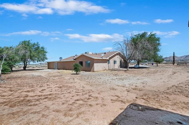 23405 Ramona Ave, Apple Valley, CA 92307 - view of home's exterior featuring stucco siding