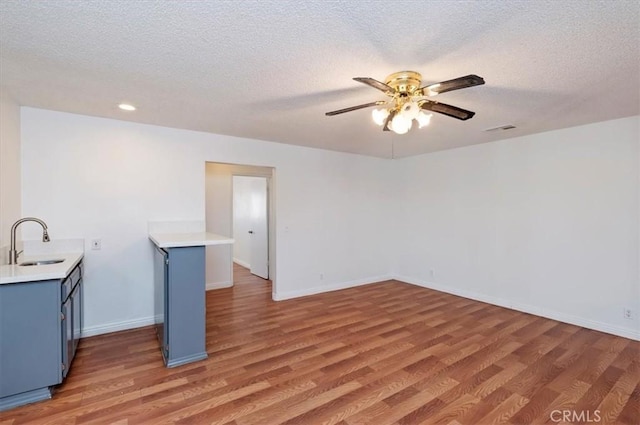23405 Ramona Ave, Apple Valley, CA 92307 - empty room with light wood-style floors, ceiling fan, a textured ceiling, and recessed lighting