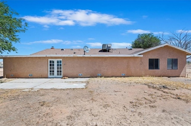 23405 Ramona Ave, Apple Valley, CA 92307 - back of property with french doors, stucco siding, and a patio area