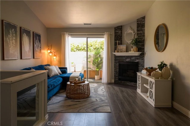 14005 Arthur Ave Unit 21, Paramount, CA 90723 - living area with wood finished floors and a stone fireplace