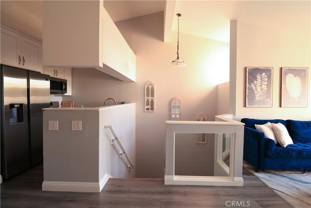 14005 Arthur Ave Unit 21, Paramount, CA 90723 - kitchen featuring stainless steel appliances, dark wood-style flooring, white cabinetry, hanging light fixtures, and open floor plan