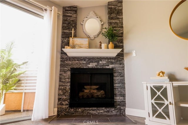 14005 Arthur Ave Unit 21, Paramount, CA 90723 - detailed view of a stone fireplace and baseboards