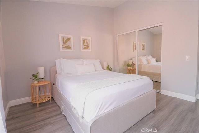 14005 Arthur Ave Unit 21, Paramount, CA 90723 - bedroom with wood finished floors and a closet