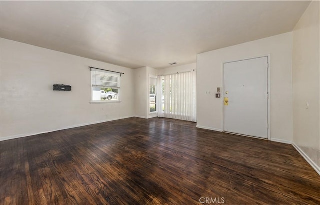 35354 Ave A, Yucaipa, CA 92399 - unfurnished living room featuring dark wood-style floors and baseboards