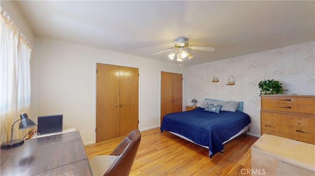 125 Hilton St, Madera, CA 93637 - bedroom featuring wood finished floors, multiple closets, and a ceiling fan