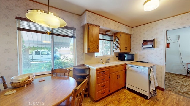 125 Hilton St, Madera, CA 93637 - kitchen featuring white dishwasher, black microwave, light wood finished floors, wallpapered walls, and light countertops