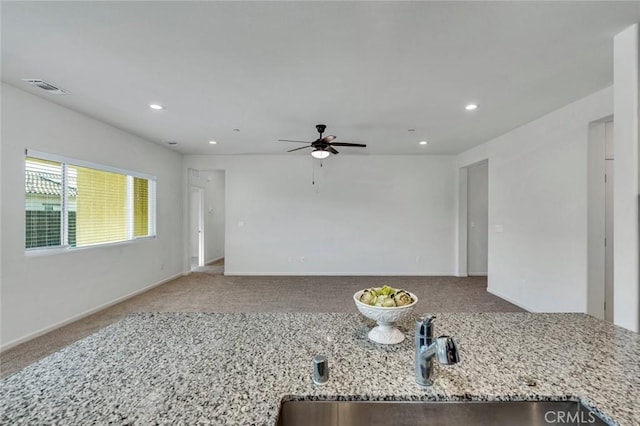 860 Fritz Dr, Los Banos, CA 93635 - unfurnished living room featuring carpet, ceiling fan, and recessed lighting