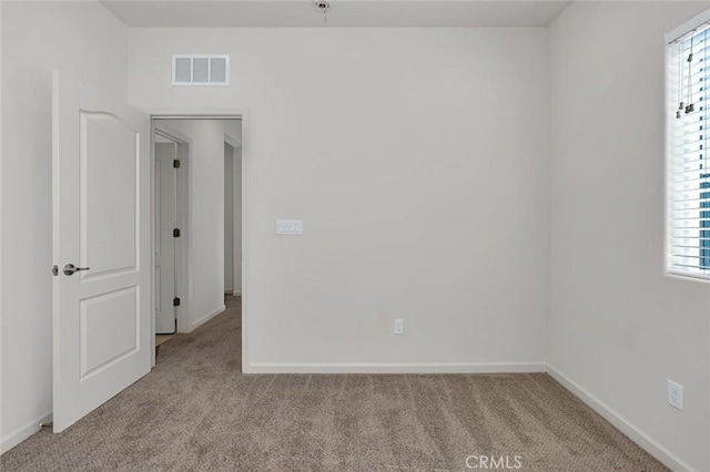 860 Fritz Dr, Los Banos, CA 93635 - carpeted empty room featuring healthy amount of natural light and a pendent fire sprinkler