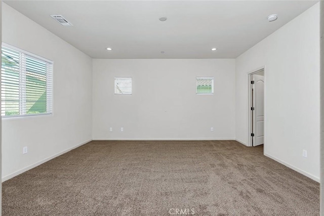 860 Fritz Dr, Los Banos, CA 93635 - empty room featuring carpet floors, plenty of natural light, recessed lighting, and a smoke detector