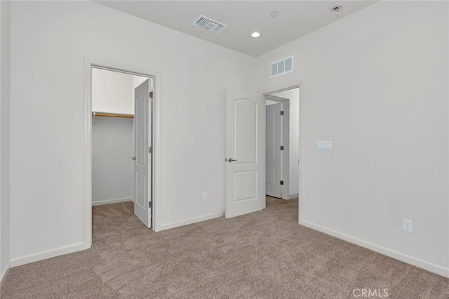 860 Fritz Dr, Los Banos, CA 93635 - unfurnished bedroom featuring carpet flooring, a spacious closet, and recessed lighting