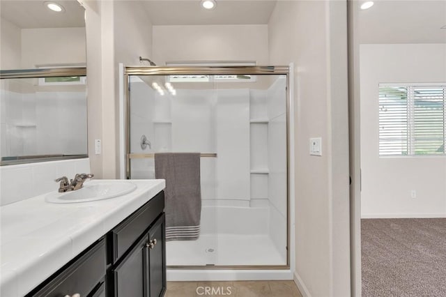 860 Fritz Dr, Los Banos, CA 93635 - bathroom with a stall shower, vanity, and recessed lighting
