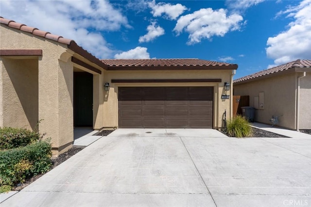 860 Fritz Dr, Los Banos, CA 93635 - mediterranean / spanish house with concrete driveway, stucco siding, a garage, and a tiled roof
