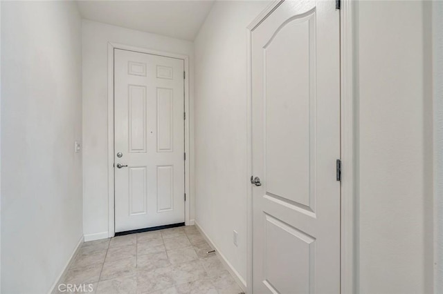 860 Fritz Dr, Los Banos, CA 93635 - doorway to outside featuring baseboards