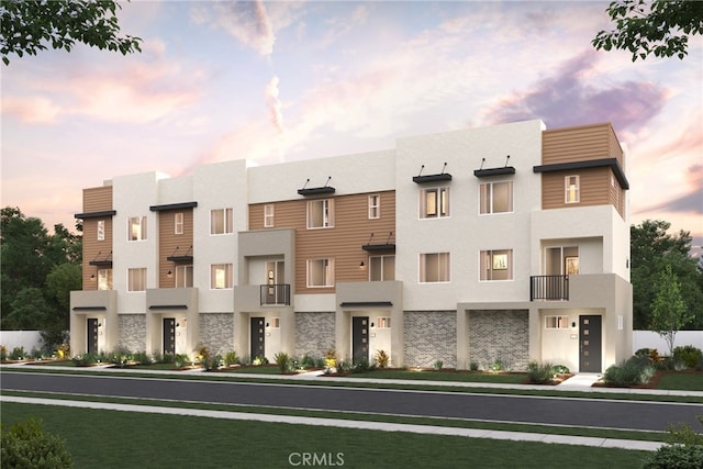 3141 Santa Anita Ave Unit E, El Monte, CA 91733 - contemporary home featuring stone siding, stucco siding, and a balcony