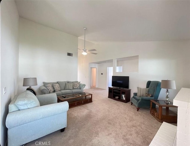 6287 Tuckaway Ave, Banning, CA 92220 - carpeted living area featuring vaulted ceiling and a ceiling fan