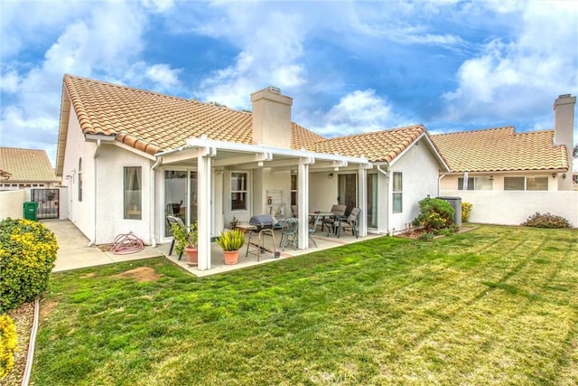 6287 Tuckaway Ave, Banning, CA 92220 - rear view of property featuring a chimney, stucco siding, a tile roof, and a patio