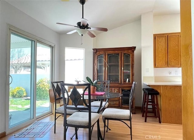 6287 Tuckaway Ave, Banning, CA 92220 - dining area featuring light wood finished floors, ceiling fan, and lofted ceiling