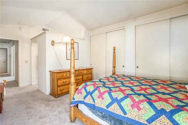 6287 Tuckaway Ave, Banning, CA 92220 - bedroom with multiple closets, light colored carpet, and vaulted ceiling