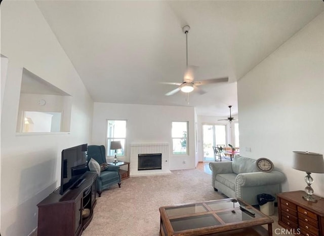 6287 Tuckaway Ave, Banning, CA 92220 - carpeted living room with a ceiling fan and a fireplace