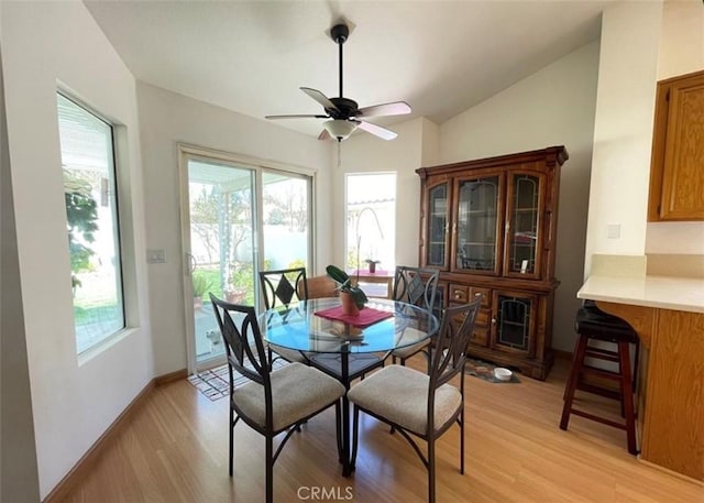 6287 Tuckaway Ave, Banning, CA 92220 - dining area featuring light wood finished floors, plenty of natural light, vaulted ceiling, and ceiling fan