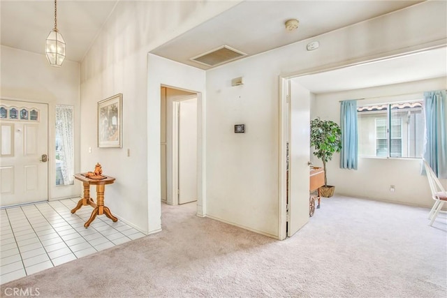 6287 Tuckaway Ave, Banning, CA 92220 - tiled entryway featuring carpet flooring and baseboards
