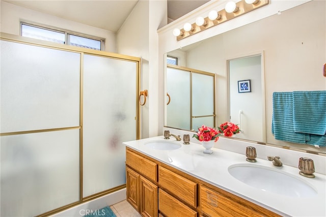6287 Tuckaway Ave, Banning, CA 92220 - full bathroom with a shower with shower door, double vanity, and tile patterned flooring