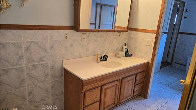 7044 Pellet St, Downey, CA 90241 - bathroom featuring vanity, tile walls, and a wainscoted wall