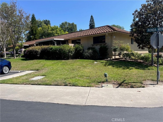 834UnitP Ronda Mendoza, Laguna Woods, CA 92637 - view of front facade with a tiled roof, a front yard, and stucco siding