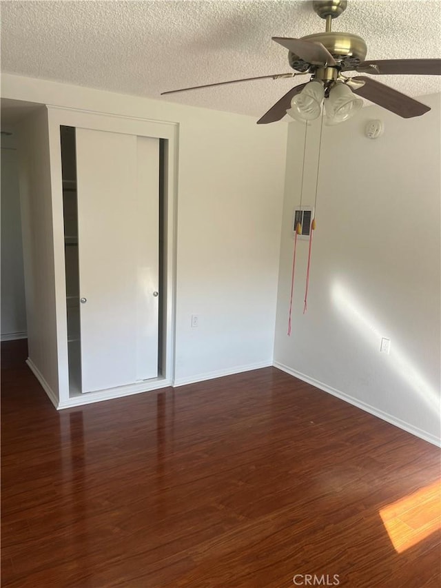 834UnitP Ronda Mendoza, Laguna Woods, CA 92637 - empty room with wood finished floors, a textured ceiling, a ceiling fan, and a smoke detector