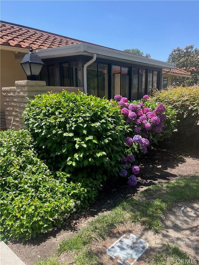 834UnitP Ronda Mendoza, Laguna Woods, CA 92637 - view of home's exterior with a sunroom