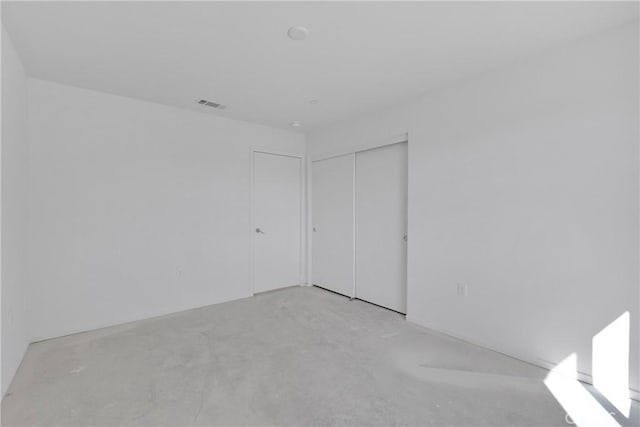 10132 Kemper Ave, Adelanto, CA 92301 - unfurnished bedroom with a closet and concrete floors