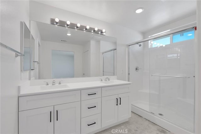 10132 Kemper Ave, Adelanto, CA 92301 - bathroom featuring double vanity and a shower stall