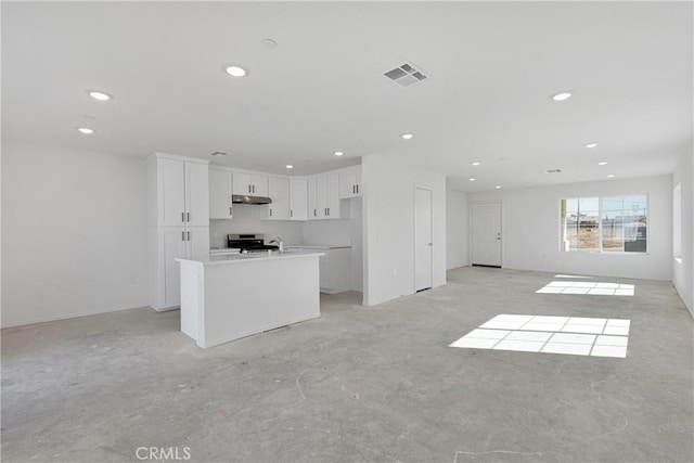 10132 Kemper Ave, Adelanto, CA 92301 - unfurnished living room featuring recessed lighting
