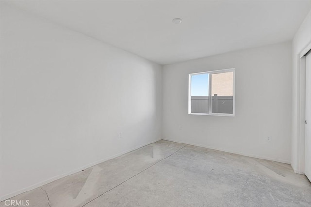 10132 Kemper Ave, Adelanto, CA 92301 - unfurnished room featuring baseboards and concrete flooring
