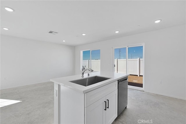10132 Kemper Ave, Adelanto, CA 92301 - kitchen featuring dishwasher, finished concrete floors, recessed lighting, white cabinetry, and a kitchen island with sink