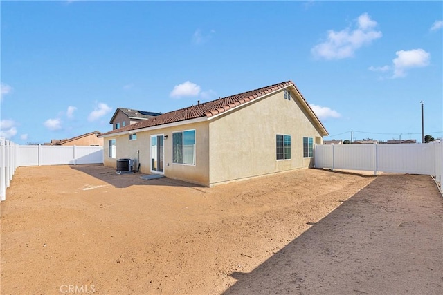 10132 Kemper Ave, Adelanto, CA 92301 - back of property with stucco siding, a tiled roof, and a fenced backyard