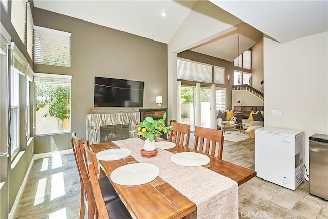 19 Las Cruces, Irvine, CA 92614 - dining room featuring high vaulted ceiling, a brick fireplace, recessed lighting, and stairway