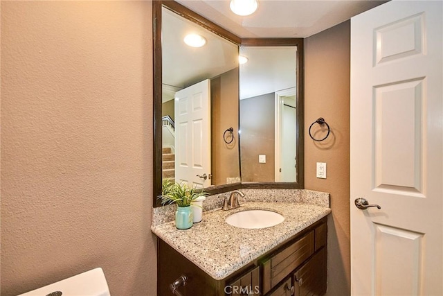 19 Las Cruces, Irvine, CA 92614 - half bathroom with vanity and a textured wall